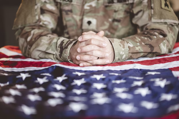 Soldier's hands on an American flag