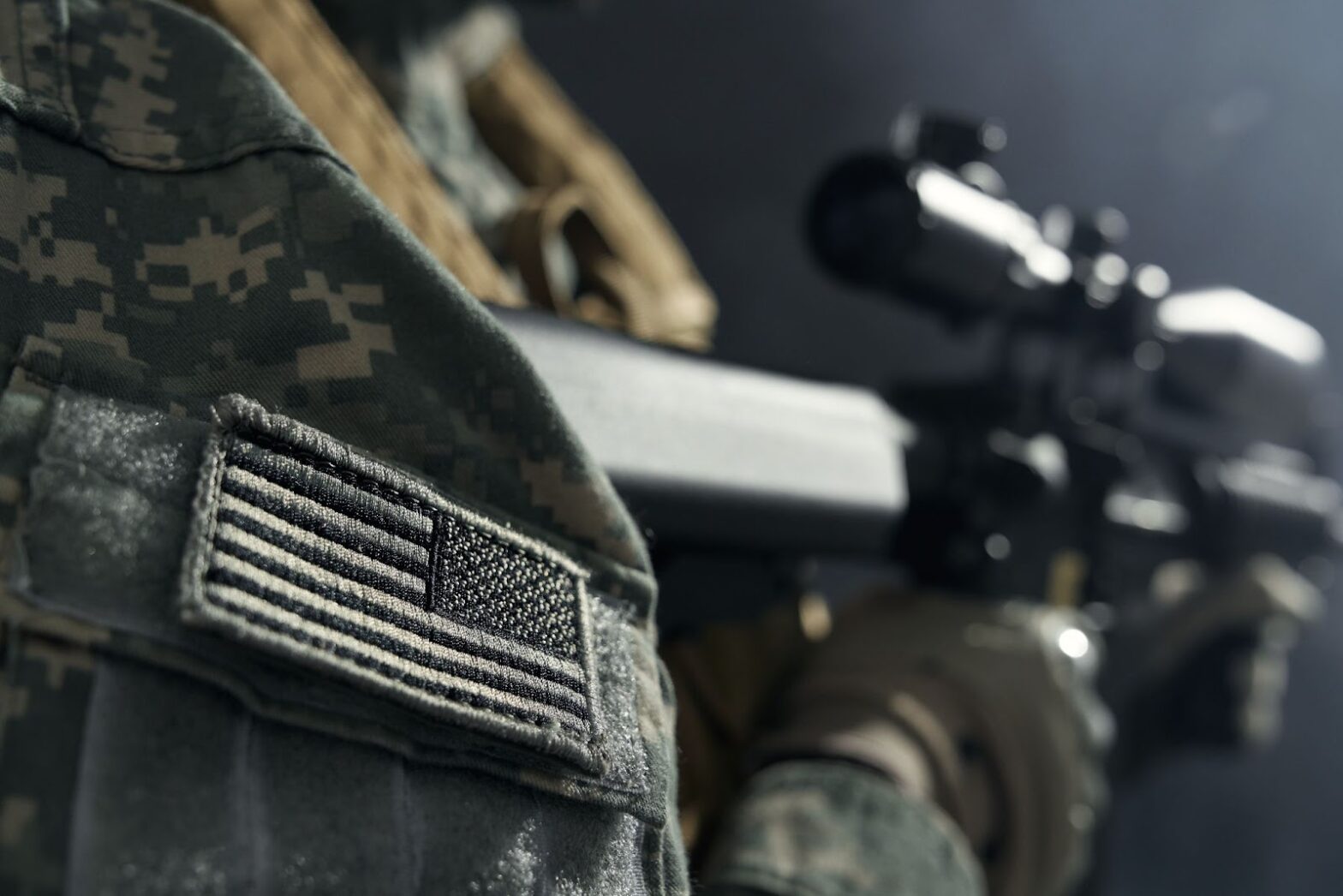 Close up of stripe of American flag on clothes of soldier